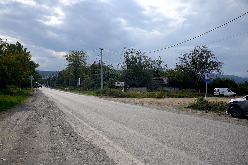 Two-lane regional road with worn asphalt surface at Tsnori in the Kakheti region of Georgia