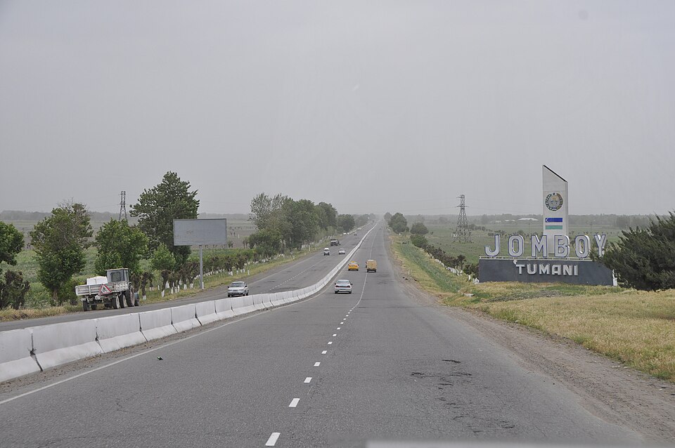 A divided highway in Uzbekistan carrying mixed traffic